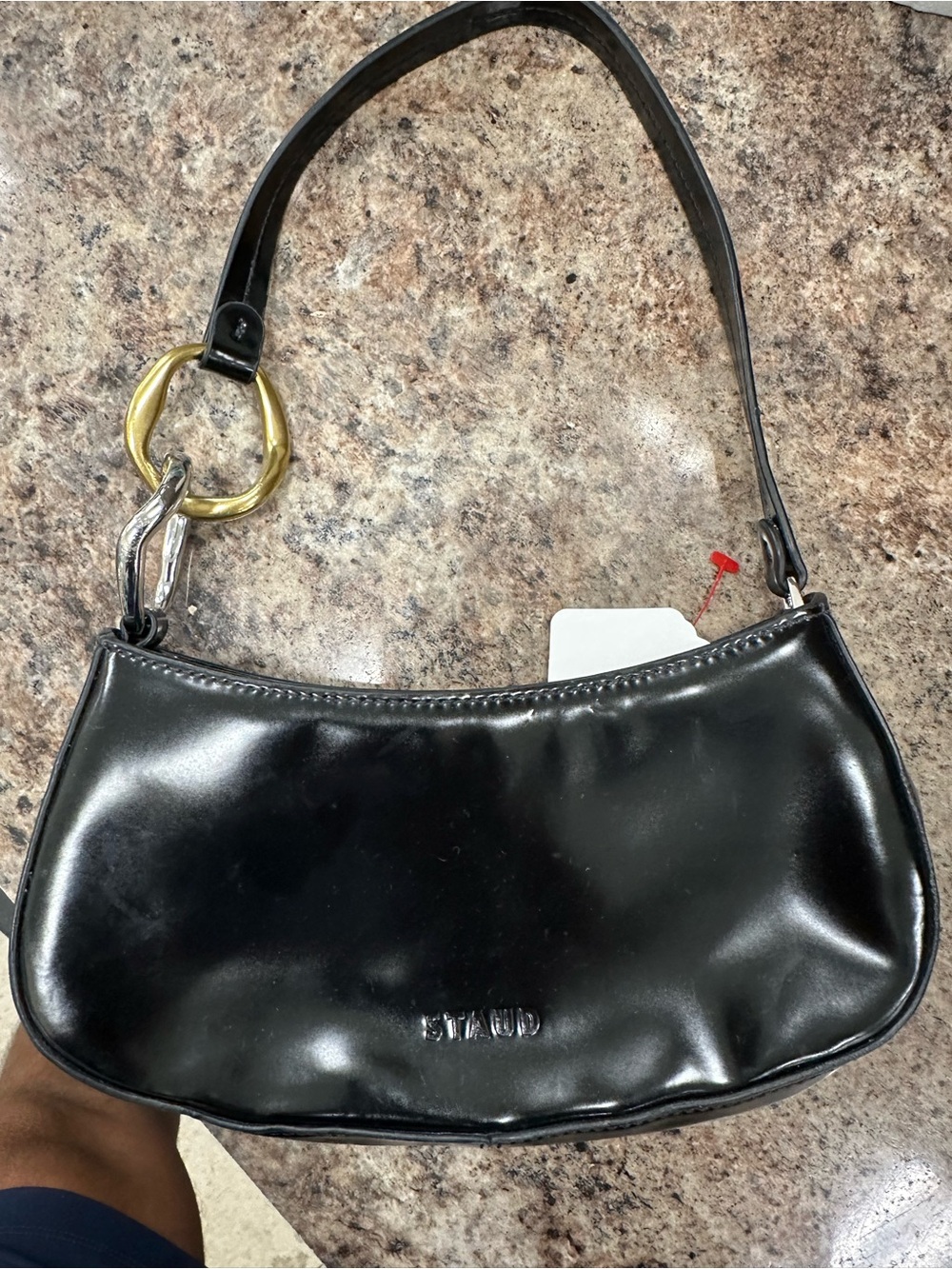 STAUD Black Leather Shoulder Bag with Gold Ring Accent